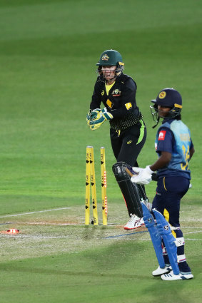 Alyssa Healy takes the bails off to run out  Hansima Karunaratne at North Sydney Oval on Monday.