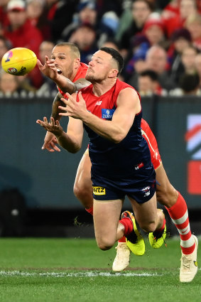 Steven May marks in front of Lance Franklin.