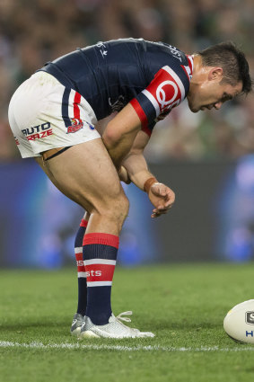 Shouldering burden: Cooper Cronk played through pain to steer the Roosters home against the Rabbitohs.