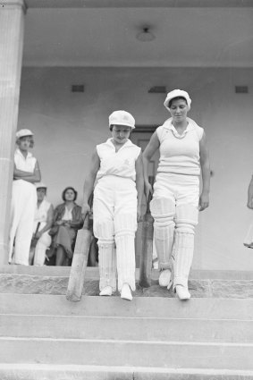 Two players step up to bat at the Women Cricketers Annual City-Country Carnival on December 16, 1932