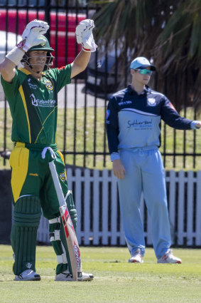David Warner calls for new gloves while Steve Smith directs traffic in the field. 