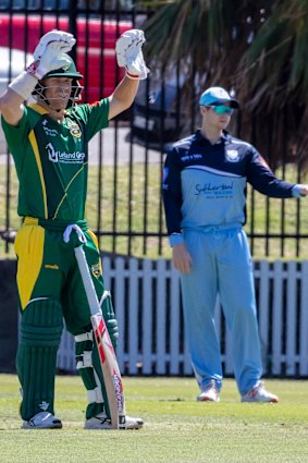 David Warner calls for new gloves while Steve Smith directs traffic in the field. 