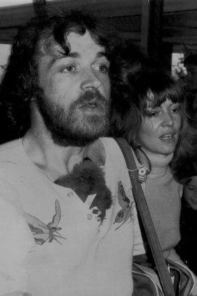 Joe Cocker, walks with friend, Eileen Webster, to the aircraft in Melbourne, 21 October 1972.