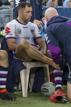 Cameron Smith receiving treatment on the bench.