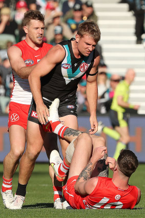 Tempers flare between Ollie Wines, right, and Peter Ladhams.
