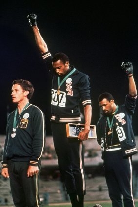 Peter Norman, Tommie Smith and John Carlos on the podium in Mexico.