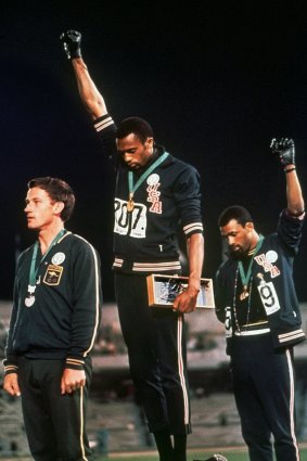 The iconic photo of Peter Norman, left, with Tommie Smith and John Carlos.