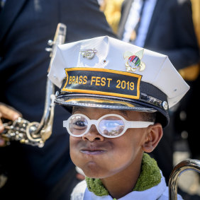 A young band member at the jazz funeral of Leah Chase.