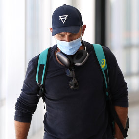 Justin Langer arrives at Perth Airport on Saturday.