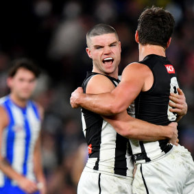 Collingwood celebrate a goal.