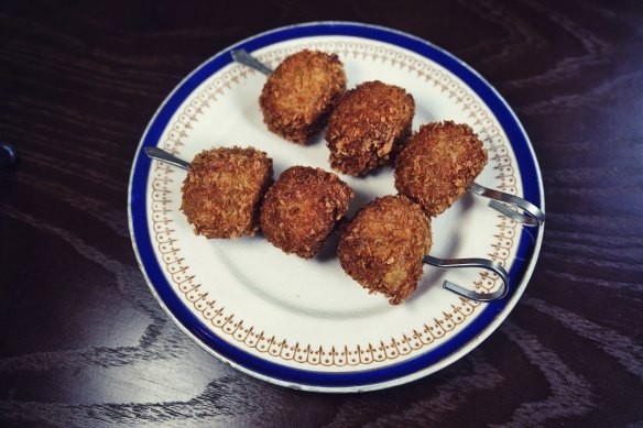 Crumbed olives stuffed with ’nduja salami.