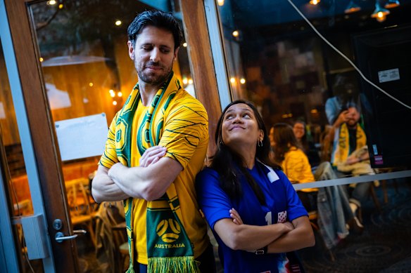 Socceroos fan Tom Stelzer and USA fan Emily Nabong watched the match together with friends.