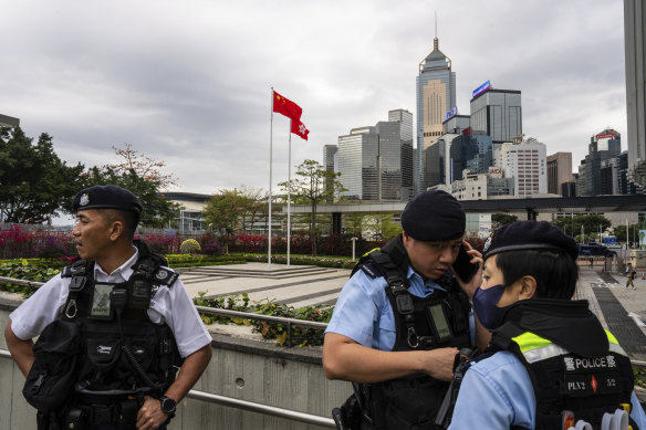 Police officers stand guard outside the Legislative Council in Hong Kong this week.