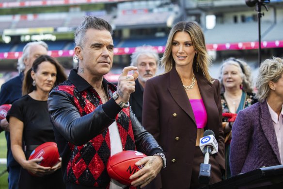 Sherrin the spotlight: Robbie Williams and Delta Goodrem at Thursday’s AFL grand final entertainment roll call.