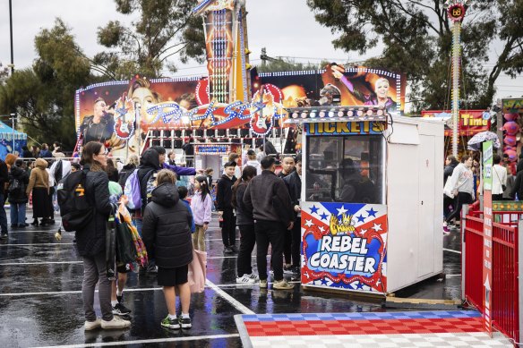 The line to the Rebel Coaster was relatively quiet after it reopened on Tuesday, but the rain shortened many lines across the showgrounds.