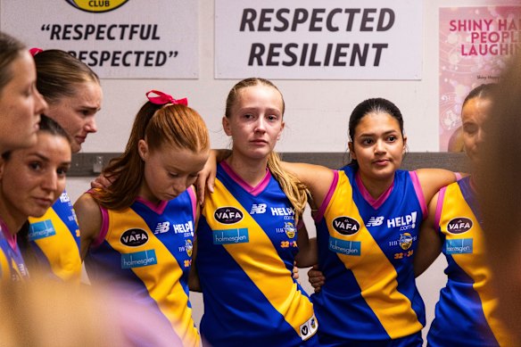 Beaumaris players gather in the change rooms before their memorial game honouring Holly and Bianca. 