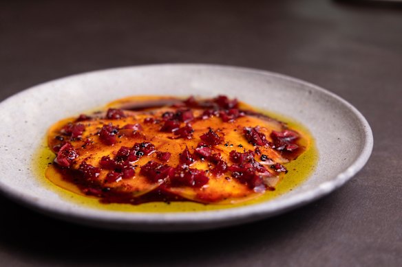 House-made ricotta with persimmon and pepperberry.