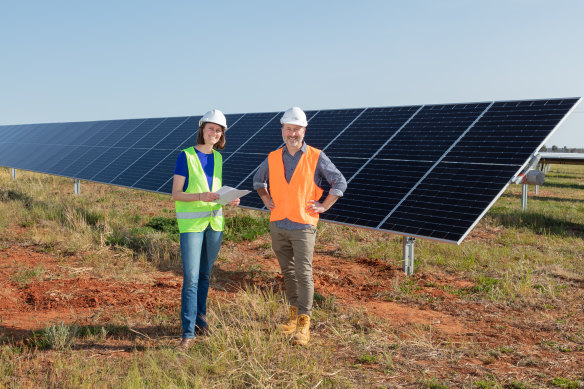 Solar garden pioneers Kristy Walters and Jonathan Prendergast, director of Komo Energy, inspect the Grong Grong site as the last panel are installed.