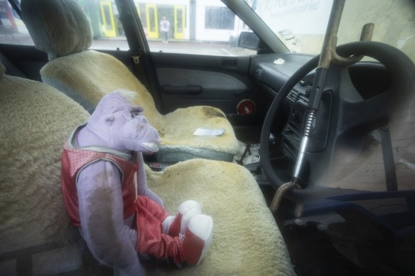 The car has sheep skin seat covers and a club steering wheel lock.