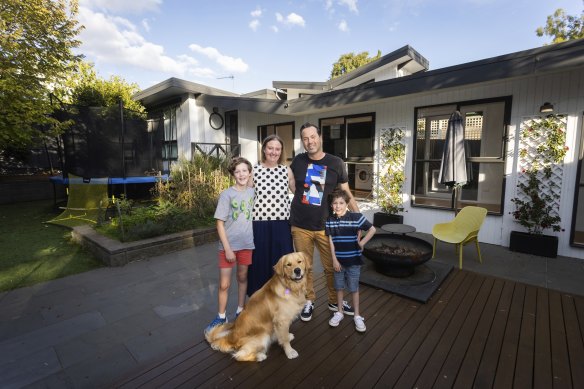 Jason and Melinda Kilgour with their children Will, 10, and Harvey, 6, at their Small Homes Service home in Blackburn.