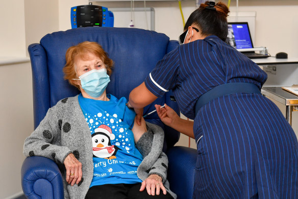 Feels privileged: 90-year-old Margaret Keenan, the first patient in the UK to receive the Pfizer-BioNTech COVID-19 vaccine, administered by nurse May Parsons at University Hospital, Coventry, England on Tuesday.