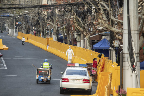 Shanghai has thrown up walls to divide locked-down neighbourhoods  from the ones that are still open.