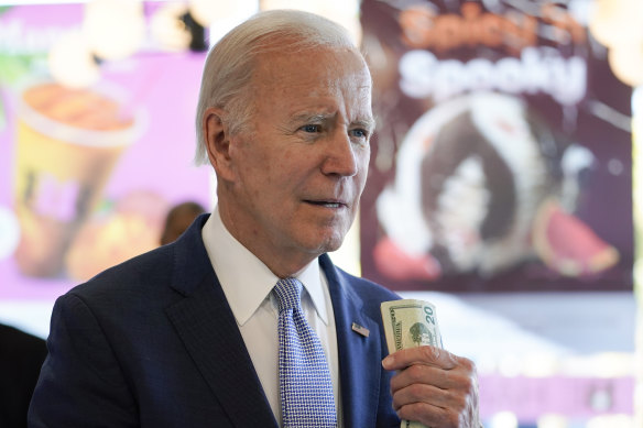 President Joe Biden, pictured holding money as he waits to buy an ice cream on Saturday in Portland, Oregon, says he is worried about inflation due to the policies of other nations.