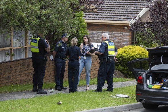 Police at the crime scene on Saturday.