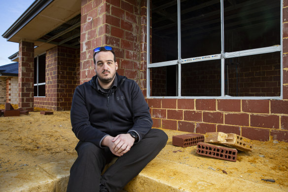Brett Martin outside his unfinished home in Mandogalup. 