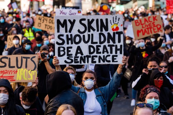 Signs included "my skin shouldn't be a death sentence".