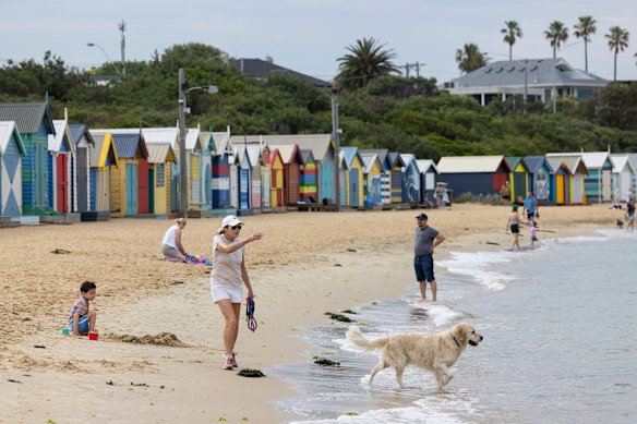 People at Brighton Beach on Friday morning, before the extreme heat kicked in.