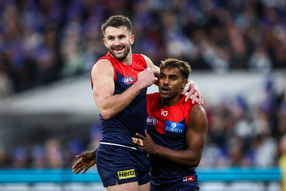 Joel Smith in happier times celebrates a goal with teammate Kysaiah Pickett.