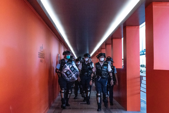 Hong Kong riot police patrol during a demonstration outside a shopping mall on May 10. 