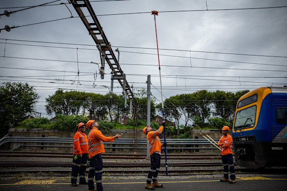 Workers used the new laser devices to check overhead wiring.
