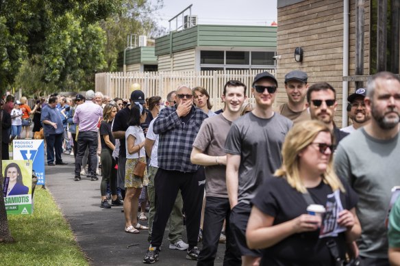 People queuing up to vote on election day.