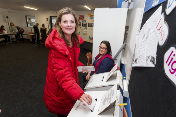 Kilkenny sporting her signature red puffer jacket while voting at Carrum Downs Secondary college during the 2018 state election.