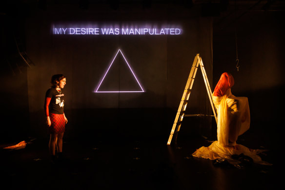 The minimalist set where colourful drapes hang suspended from the ceiling is transformed into an otherworldly plain.