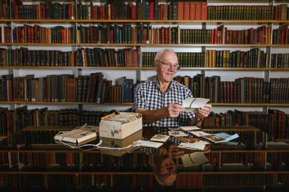 Richard Smith looking at the collection of his mother’s letters sent from London during WW2.  He donated them to the State Library of NSW. 