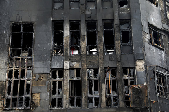 Shattered windows line a building that was set ablaze during recent protests over government-set gasoline prices rises, in Tehran, Iran.