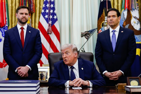 Donald Trump flanked by JD Vance and Marco Rubio in the Oval Office of the White House in April.