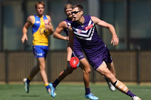 Mason Cox in action for the Dockers in a match simulation game against the West Coast Eagles in February.