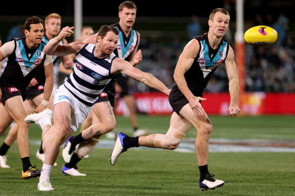 Patrick Dangerfield, left, in action against Port Adelaide. 