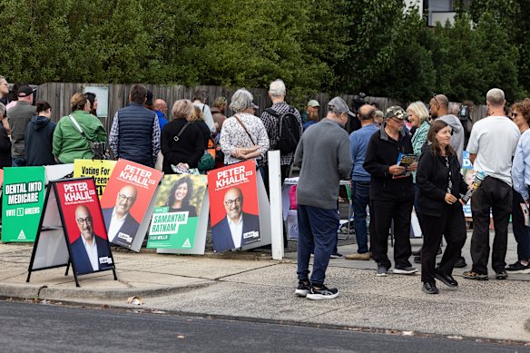 Voters line up at Brunswick Masonic Centre to vote early.
