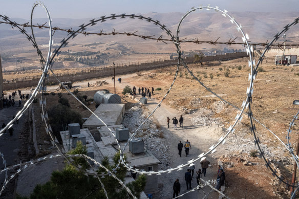A view of Syrians coming and going at Sednaya, a notorious prison, now empty of prisoners.