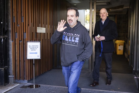 Outgoing tourism, sport and major events minister Martin Pakula (left) leaves Saturday’s caucus meeting.