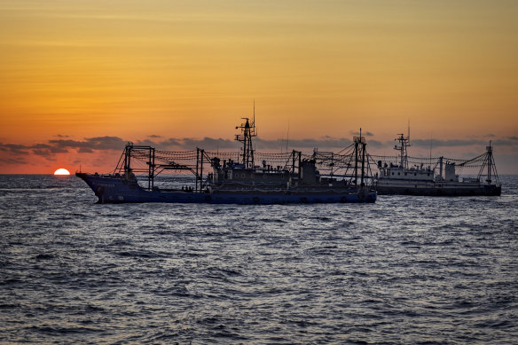 Chinese militia ships are seen as Philippine ships conduct a resupply mission to troops stationed in the South China Sea on Tuesday.