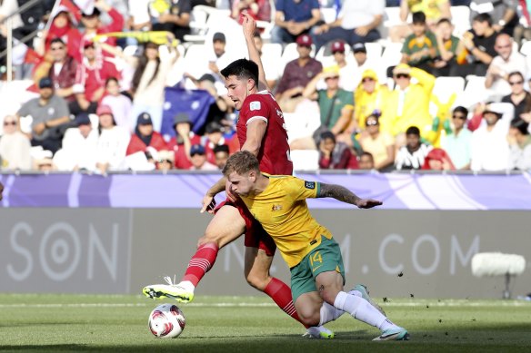 Baggott fights for the ball with McGree.