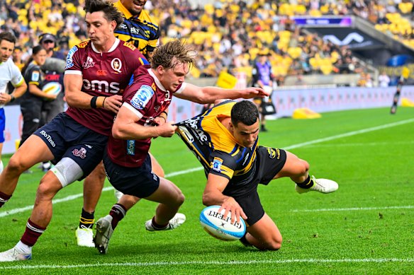 Josh Moorby of the Hurricanes scores during against the Reds at Hnry Stadium in Wellington.