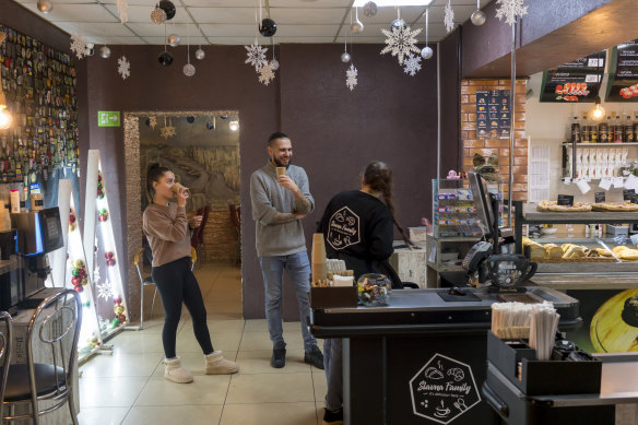 Serhii Kovalov, centre, chats with employees at Slavnyi Horod earlier this year.