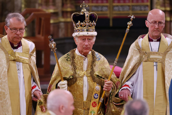 King Charles III stands after being crowned during his coronation ceremony in Westminster Abbey in London on May 6.